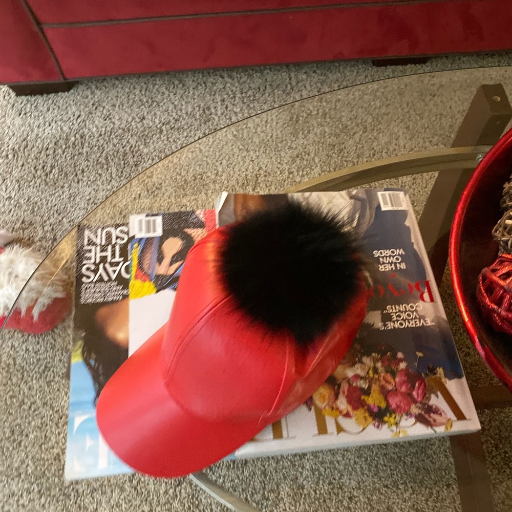 Baseball cap with fur ball